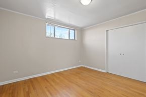 Denver apartment for rent - a living room with wood floors and white walls and a window