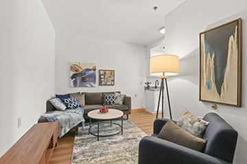 Greeley apartment for rent - a living room with couches and a coffee table