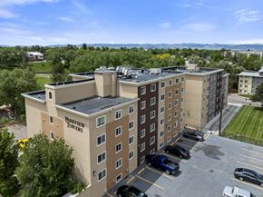 Englewood apartment for rent - A parking lot is in front of a multi-story building named Purview Towers.