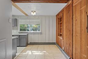 Lakewood apartment for rent - A kitchen with wooden cabinets and a window.