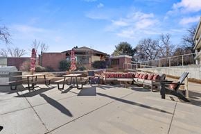 Greeley apartment for rent - A sunny day at a picnic area with tables and chairs.