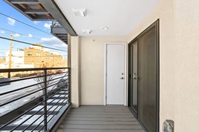 Denver apartment for rent - the entrance to a balcony with a door and a view of the city