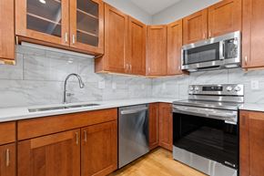 Boulder apartment for rent - A kitchen with wooden cabinets and stainless steel appliances.