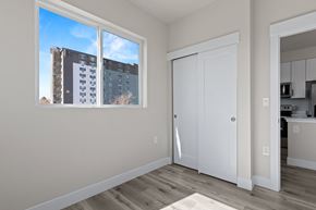 Denver apartment for rent - A room with a large window overlooking a building.