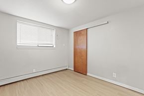 Denver apartment for rent - the living room of an apartment with a door and a window