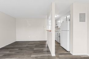 Denver apartment for rent - an empty kitchen with white appliances and a white refrigerator