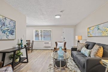 Longmont apartment for rent - a living room with a couch and a glass coffee table