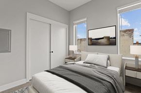 Denver apartment for rent - a bedroom with a bed and two windows