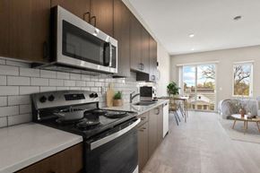 Denver apartment for rent - a kitchen with a stove and a microwave