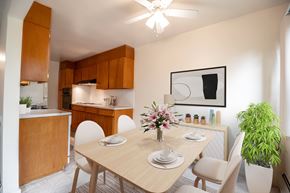 Littleton apartment for rent - A dining room with a wooden table and chairs.