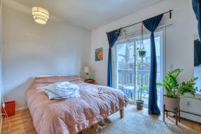 Boulder apartment for rent - a bedroom with a bed and a large window