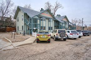 Boulder apartment for rent - a row of green houses with cars parked in front of them