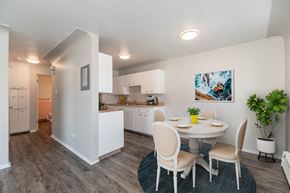 Aurora apartment for rent - A kitchen with a dining table and chairs.