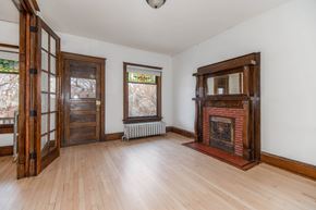Denver apartment for rent - A room with a fireplace and a window.