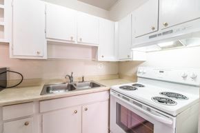 Denver apartment for rent - A white stove and sink in a kitchen.