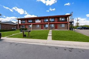 Lakewood apartment for rent - A red building with a sign that says "Apartments" on it.