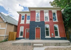 Denver apartment for rent - A red and blue two story house with a red door.