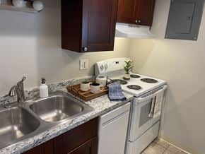 Englewood apartment for rent - kitchen with a white oven at Kingsbrook Arms, Englewood