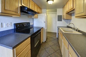 Boulder apartment for rent - a kitchen with a stove refrigerator and sink