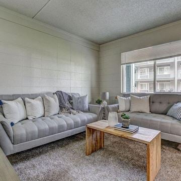 Greeley apartment for rent - a living room with couches and a coffee table