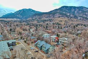 Boulder apartment for rent - arial view of the village with mountains in the background