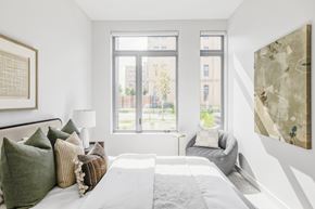 Boulder apartment for rent - A bedroom with a large bed and a large window.