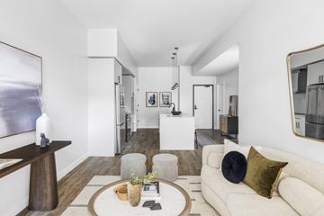 Boulder apartment for rent - A modern living room with a white couch and a coffee table.