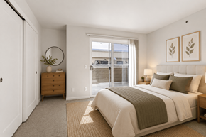 Boulder apartment for rent - A bedroom with a large bed and a dresser.