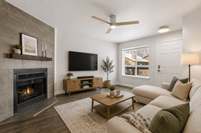 Boulder apartment for rent - A living room with a fireplace and a flat screen TV mounted on the wall.