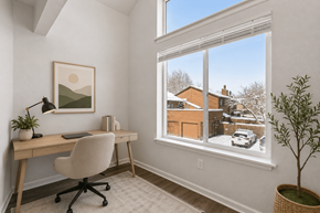 Boulder apartment for rent - A room with a desk and chair in front of a window with a view of a snowy street.