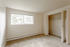 Fort Collins apartment for rent - a bedroom with a large window and a closet