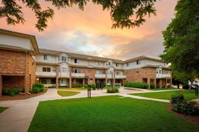 Longmont apartment for rent - Apartment complex with a grassy area in front.
