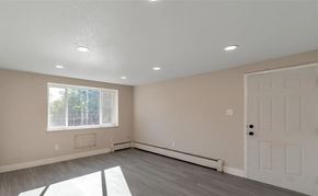 Denver apartment for rent - A room with a white door, window, and a window sill.