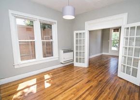 Denver apartment for rent - A room with a wood floor and a window.