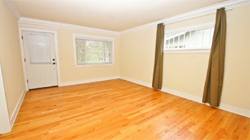 Denver apartment for rent - a living room with a hard wood floor and a white door and curtains