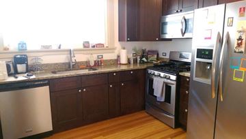 Denver apartment for rent - A kitchen with a stainless steel refrigerator and oven.