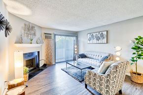 Denver apartment for rent - Living Room With Fireplace at Miramar Apartments, Denver, CO 80231