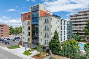 Denver apartment for rent - an aerial view of an apartment building with a pool and trees