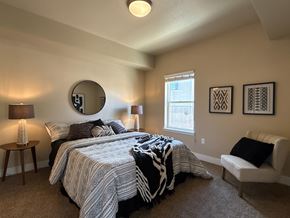 Fort Collins apartment for rent - A bedroom with two beds and a chair.
