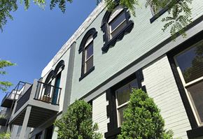 Denver apartment for rent - the side of a white house with windows
