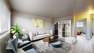 Denver apartment for rent - A living room with a grey sofa and a wooden coffee table.