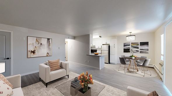 Arvada apartment for rent - A living room with a grey couch and a coffee table.