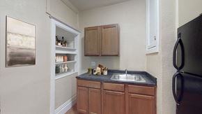 Denver apartment for rent - a kitchen with a sink and a refrigerator