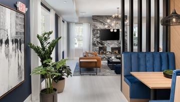 Hillsborough apartment for rent - a living room with blue furniture and a fireplace