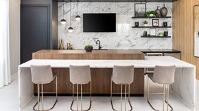 Hillsborough apartment for rent - a kitchen with a marble counter top and four chairs