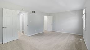 Bethlehem apartment for rent - A spacious room with white doors and carpeted floor.