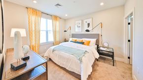 York apartment for rent - a bedroom with a bed and yellow curtains