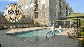 Pohatcong Township apartment for rent - Pool area of Monte View at Pohatcong with badge showing the community won a 2026 New Jersey Builders Association Sales and Marketing Award.