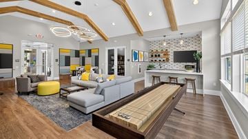 York apartment for rent - A modern living room with a grey sofa and a wooden coffee table.