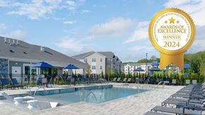 Bordentown apartment for rent - a swimming pool with chairs and a yellow award sign